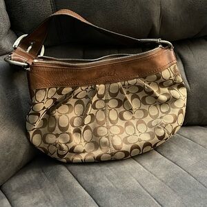 Brown and tan coach purse. Well used